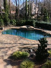 Pool deck pavers around backyard pool in Hampton Roads